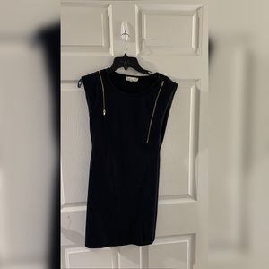 black dress with gold zipper.